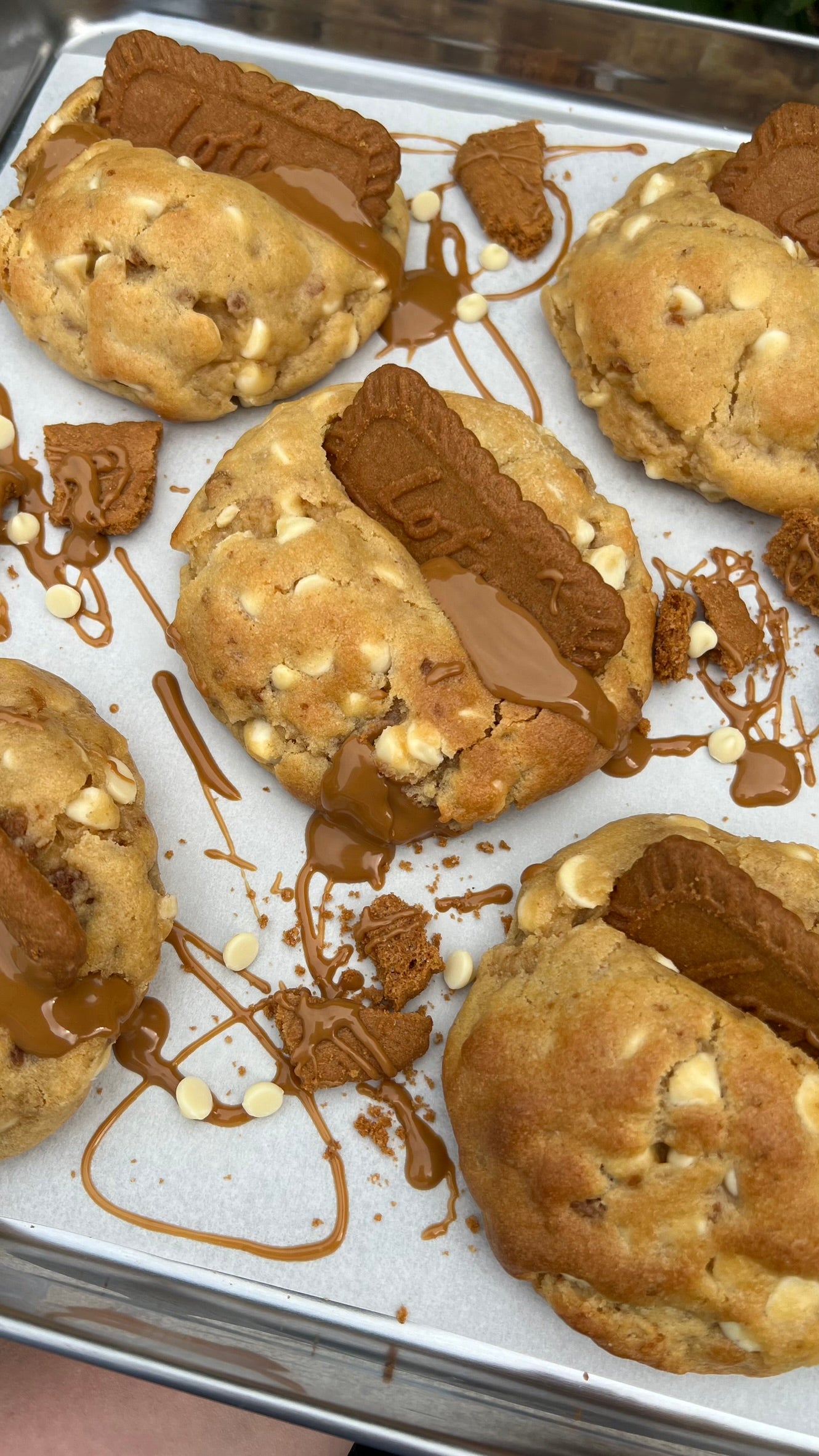 Buy White Choccy Biscoffy cookies online. White chocolate dough with a gooey Biscoff centre.