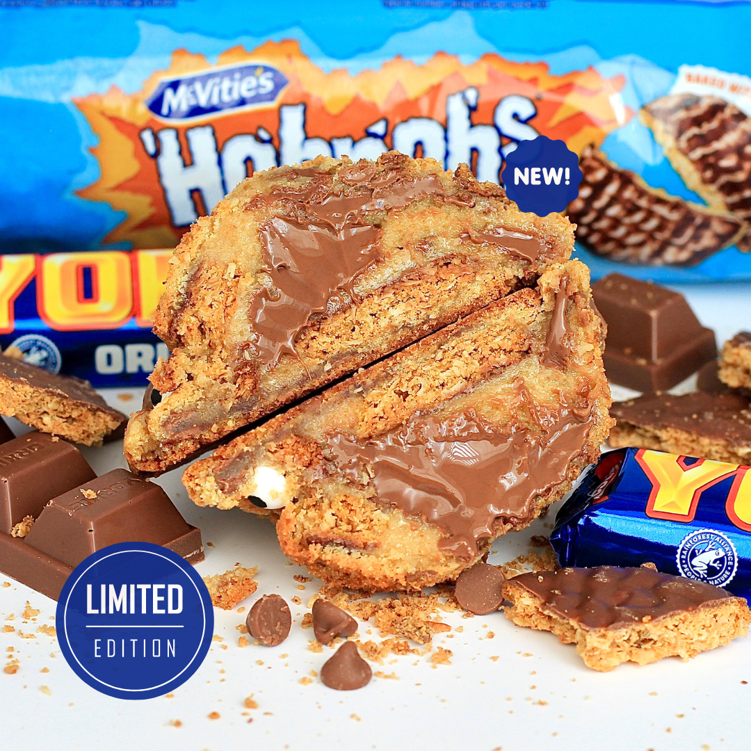 Close-up of Dolly’s Dough Hobgoblin NYC-style cookie packed with McVitie’s chocolate Hobnobs, chunky Yorkie pieces, and Belgian milk chocolate chips. Freshly baked and ready to order across the UK.