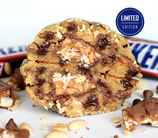 Snickers cookie from Dolly’s Dough, filled with chocolate chips, caramel, and roasted peanuts. Limited edition New York style cookie, back by popular demand.
